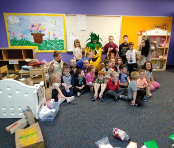 Children pose with Spike during the Grand Opening and ribbon cutting ceremony.